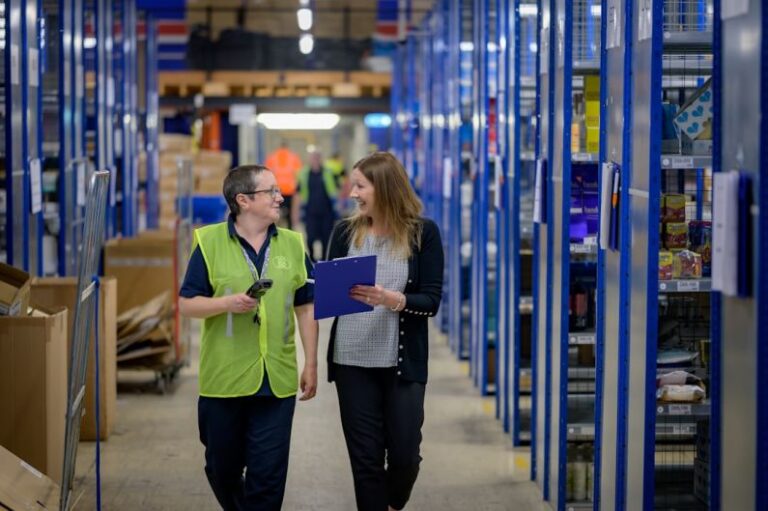 Cost Reduction Warehouse - a man and a woman in a warehouse