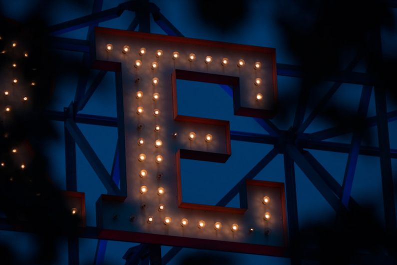 Electric Commercial - a lit up sign that says e is for e