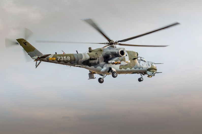 Technology Transport - low angle photography of brown and gray helicopter