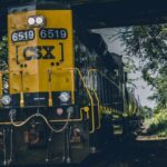 Autonomous Freight - yellow and black CSX train