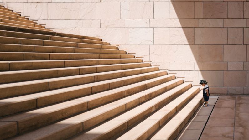 Last-mile Challenge - toddler's standing in front of beige concrete stair