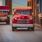 Autonomous Truck - red Dodge car on asphalt road during daytime