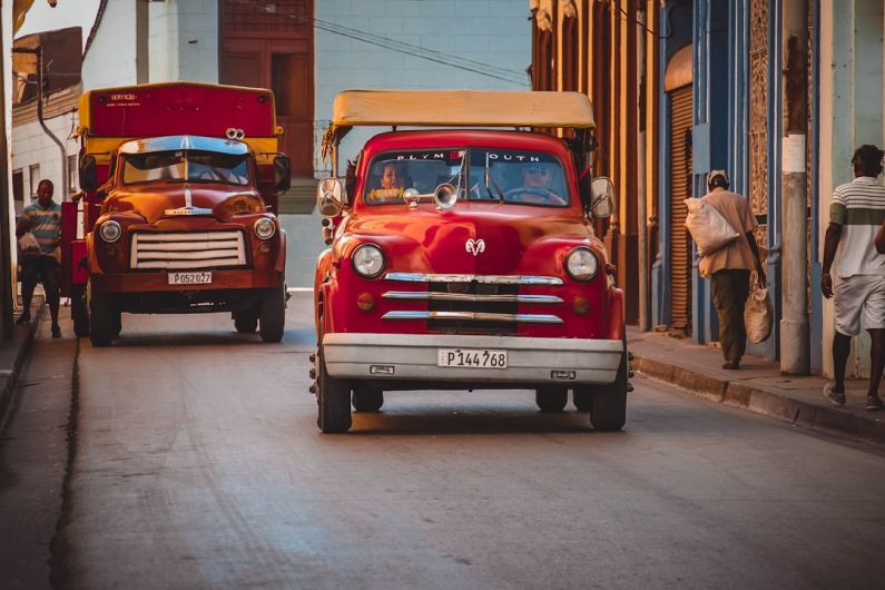 Autonomous Truck - red Dodge car on asphalt road during daytime