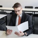 Resume Tips - man holding folder in empty room