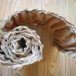 Recycling Logistics - white and black textile on brown wooden table