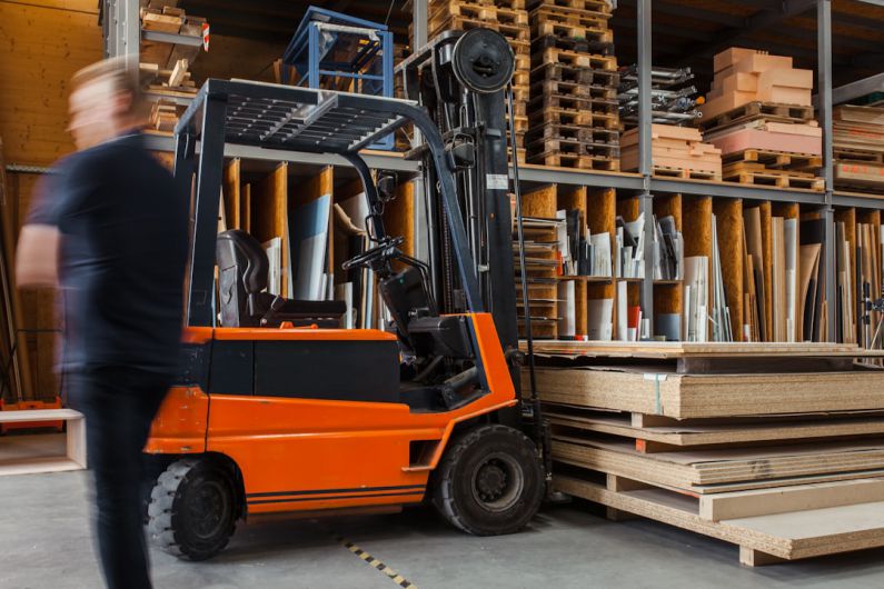 Warehouse Shelves - yellow and black fork lift