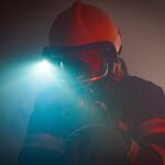 Disaster Response - man in black jacket wearing black goggles and helmet