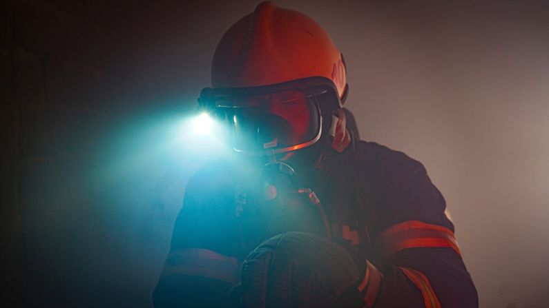 Disaster Response - man in black jacket wearing black goggles and helmet