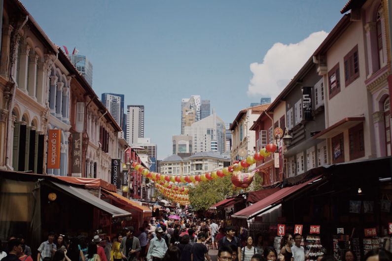 Emerging Market - people near building