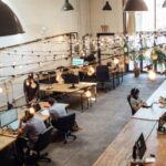 Warehouse Layout - people sitting in front of computer monitors