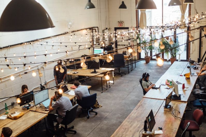 Warehouse Layout - people sitting in front of computer monitors