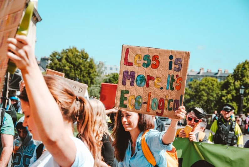 Reduce Waste - group of person with signage