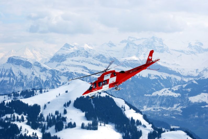 Efficient Transport - photo of flight of red and white rescue helicopter during snow daytime