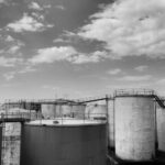 Multi-modal Transport - grayscale photo of factory under cloudy sky