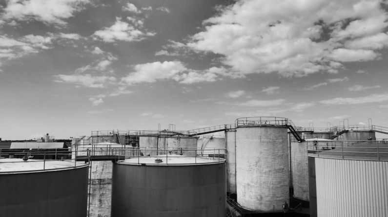 Multi-modal Transport - grayscale photo of factory under cloudy sky