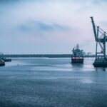 Freight International - black ship on sea under white sky during daytime