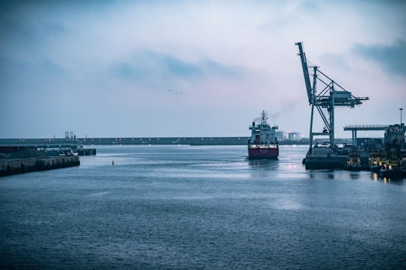 Freight International - black ship on sea under white sky during daytime